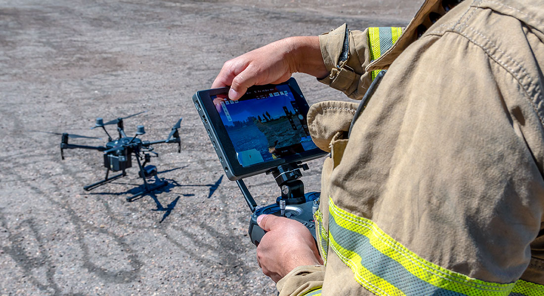 A firefighter check his drone before rescue misson